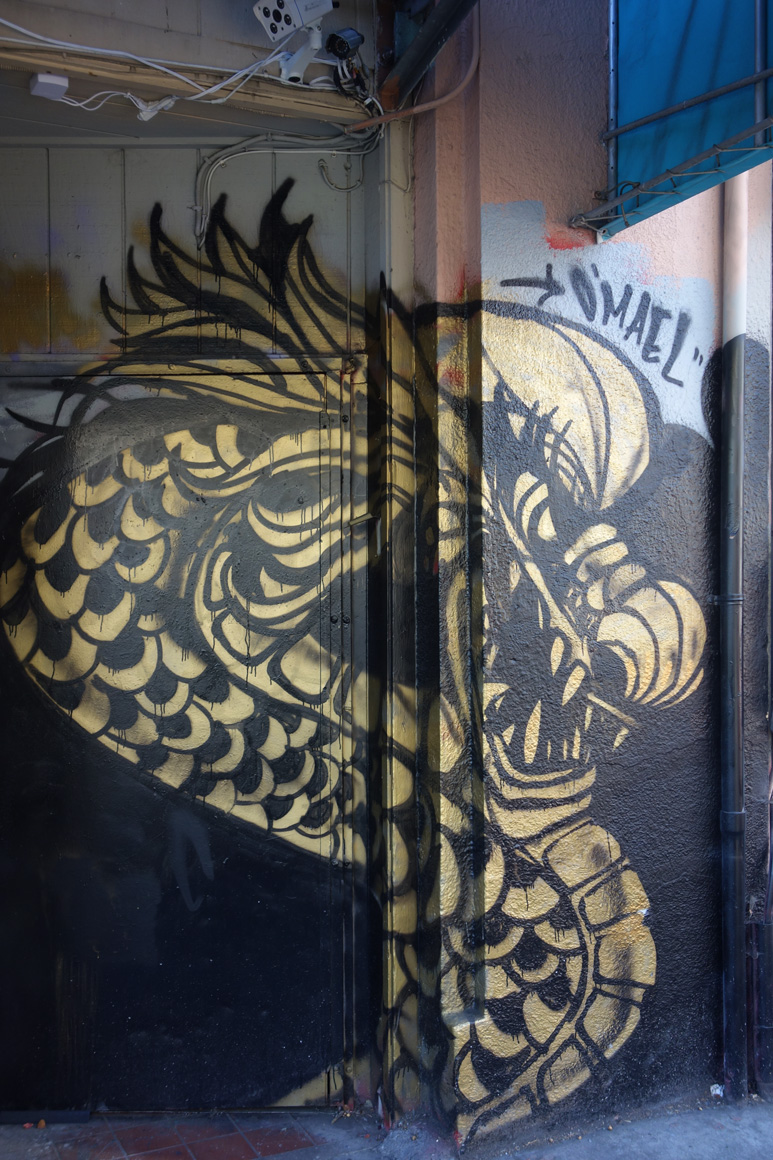 Dragon School street art golden dragons in Oakland Chinatown